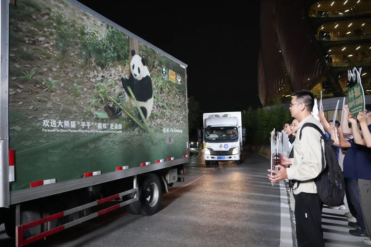 Chinese Staff See Off the Transport Truck